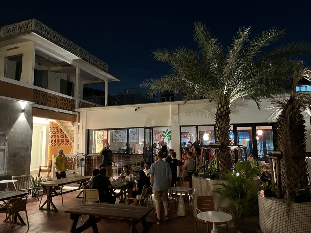 View of the inner courtyard at Two Palms Taproom in Bangkok, Thailand.