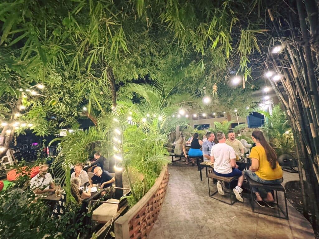 View of outdoor seating area at Pomme Brewhouse in Siem Reap, Cambodia.