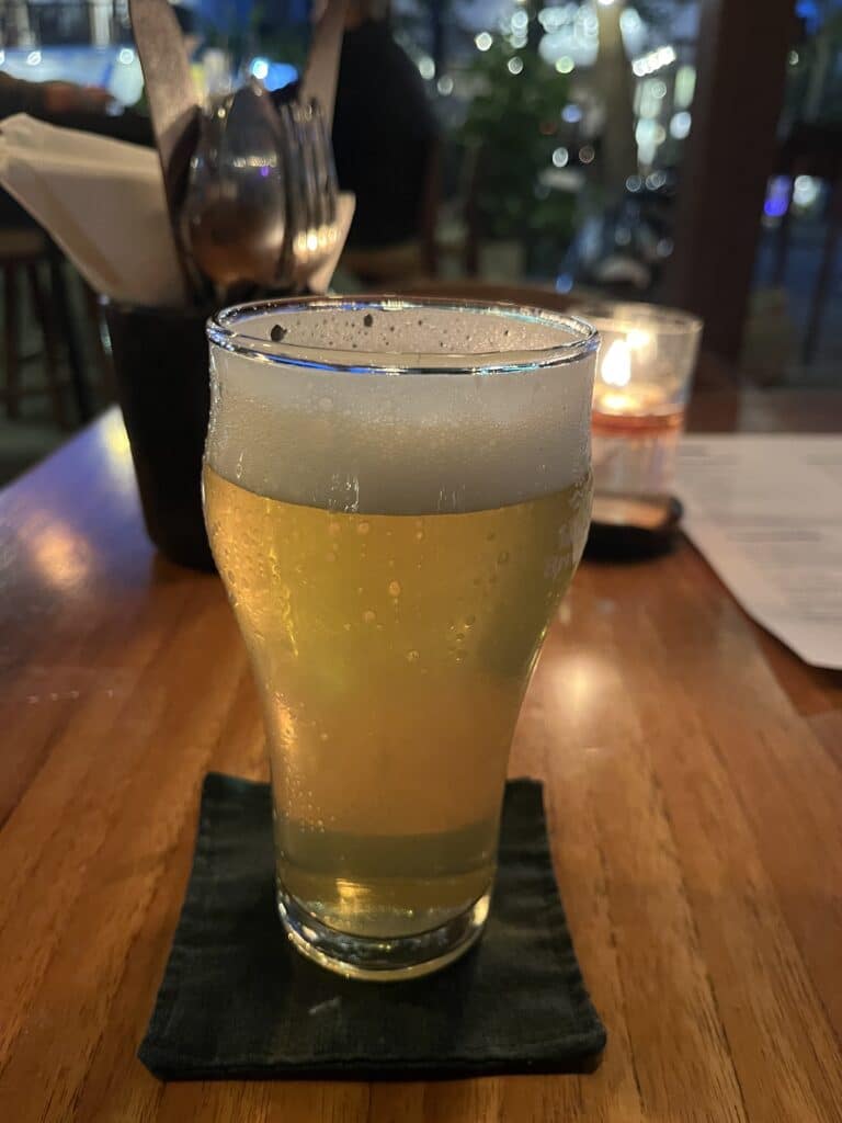 Glass of Island Brewing Pilsner at Knalpot Restaurant & Bar in Kuta, Lombok.